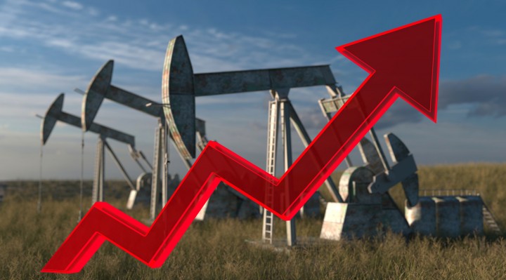 the price of oil rising up - Oil wells - oil pumps on sky background with red arrow